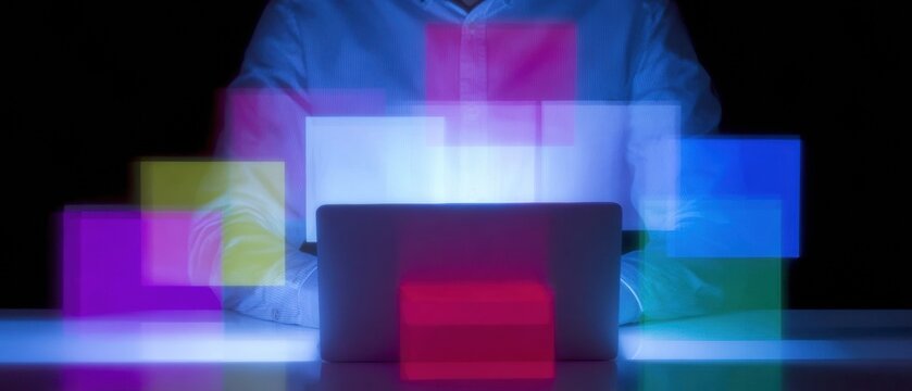 Professional Digital Marketer Using Laptop and Smartphone with Interactive Email Marketing Icons Modern Creator Economy Content for Business Campaigns