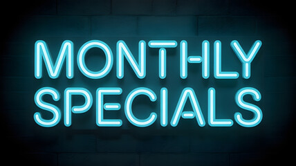 Vibrant neon sign glows "MONTHLY SPECIALS" on brick wall, attracting customers with bright, modern allure.