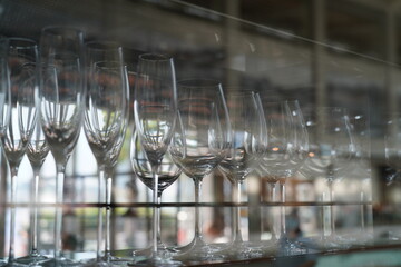 Rows of empty wine glasses capturing elegance anticipation and reflection
