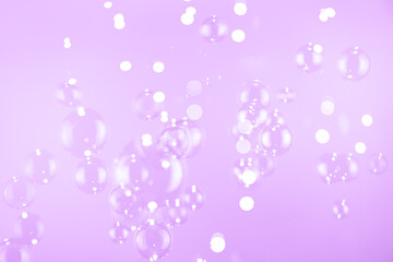 Beautiful Shiny Purple Soap Bubbles Floating in The Air. Purple and White Gradient Textured. Celebration Festive Backdrop. Freshness Soap Suds Bubbles Water.	
