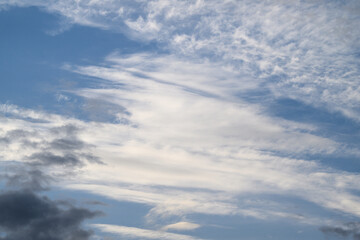 The Serene and Tranquil Skies with Beautiful Wispy Clouds Stretching Across the Horizon