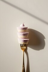 Pastel Mousse Dessert Stack on Golden Fork, Minimalist Composition