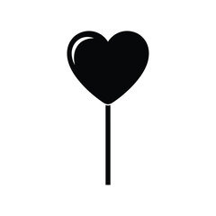 Black heart shaped lollipop on a stick candy sweet