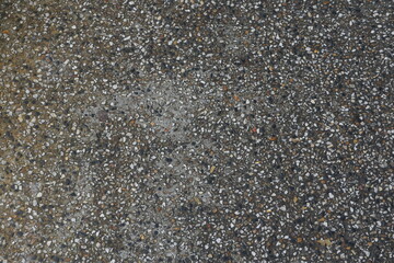 Exposed aggregate concrete decorative textured surface with natural stone finish