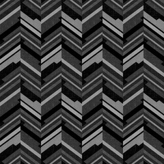 Seamless monochrome grey and black textured zig zag pattern