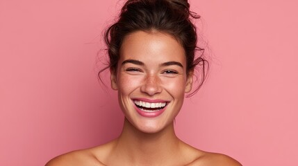 A joyous young woman beams against a pink background highlighting her radiant skin and natural beauty Ideal for wellness and skincare themes