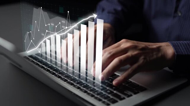 A focused business professional analyzes data trends on a laptop, featuring graphs and metrics that represent growth and performance improvement in a digital workspace. Copula - Powered by Adobe