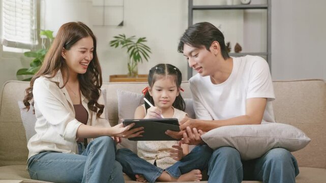 Family engaging with digital media at home interactive learning session cozy living room family bonding modern technology