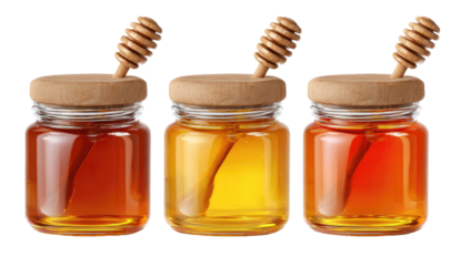 Three glass jars of honey, each with a wooden honey dipper, showcasing different honey hues