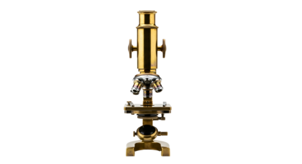 Golden antique microscope with multiple lenses on black background