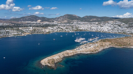 Obraz premium Aerial View of Bodrum Gümbet with Yachts and Clear Blue Water