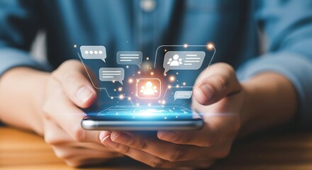 Hands holding smartphone displaying chat bubbles and user icons