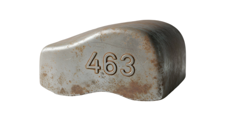 Gray metal object with number 463, rounded edges, weathered