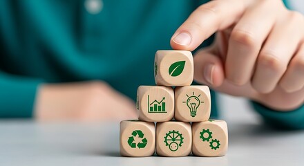 Person's Finger Stacking Wooden Blocks with Eco Icons