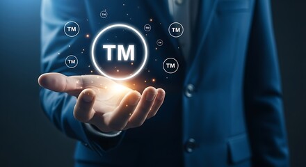 Hand holding glowing trademark symbol brand logo