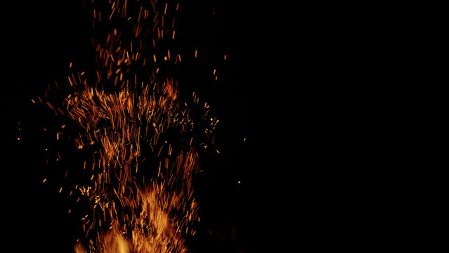 sparks and embers from campfire flying over black background