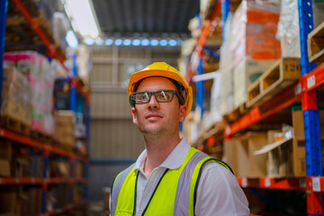 Blue collar worker is working at warehouse.