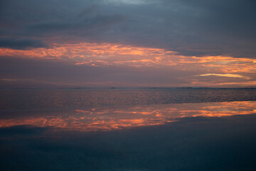 sunset over the sea sunrise clouds reflection pool