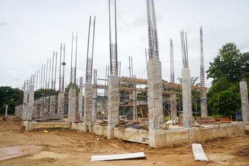 The building construction area is in the process of erecting the main structure, with reinforced...