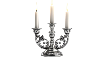 Ornate silver candelabra with three lit candles on black background