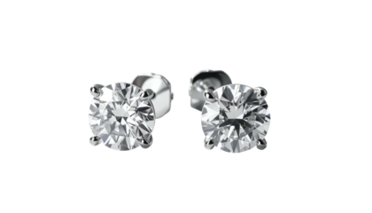 Pair of round-cut diamond stud earrings on a plain background