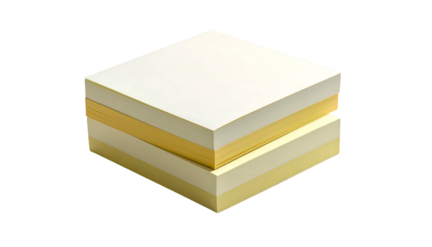 Stacked yellow and white square papers on a solid dark surface