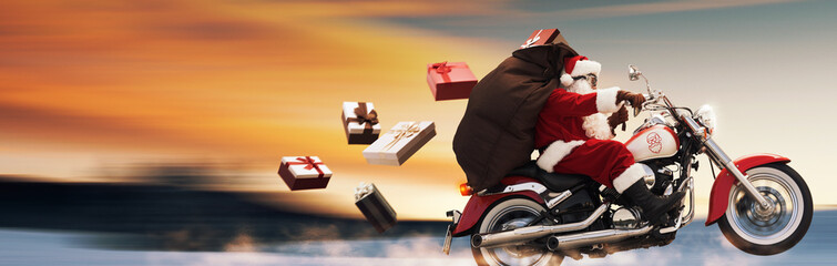 Confident Santa Claus riding a fast motorbike