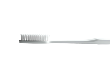 White toothbrush on black, bristles face up