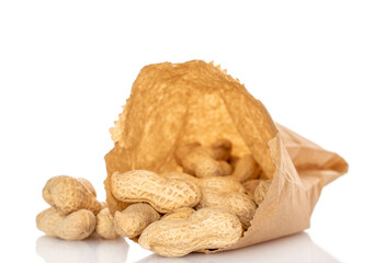 Unshelled peanuts isolated on white background, macro.