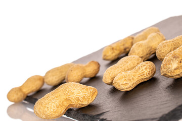 Unshelled peanuts isolated on white background, macro.