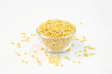 Soy milk in a glass cup and hsoybeans on a wooden table. Healthy food concept.