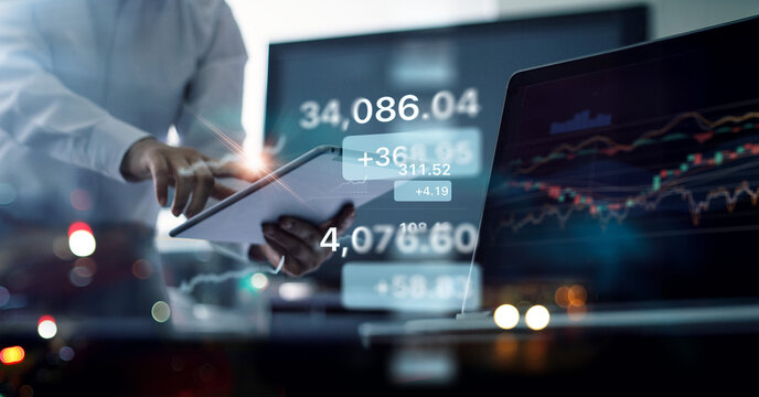 Businessman and broker analyzing profit of investment and stock market growth performance forecast and financial growth of business, Investor and stock exchange trading. - Powered by Adobe