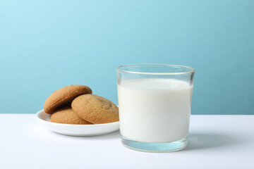 glass of milk, bread on the background
