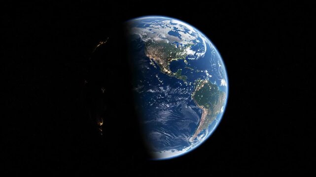 Earth from space showing the terminator line and city lights