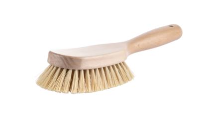 Cleaning brush made of wood and fibers on a black background