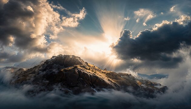 Majestic Mountain Majesty: Sunlit Peaks Amidst Dramatic Clouds