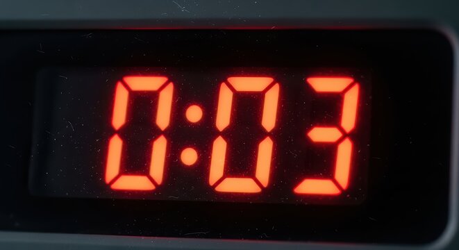 Red digital timer display showing countdown with three seconds remaining