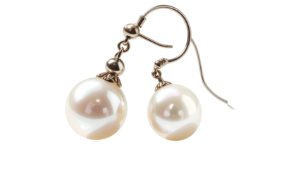 Two pearl drop earrings on silver hooks against a dark background