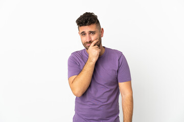Caucasian man isolated on white background having doubts