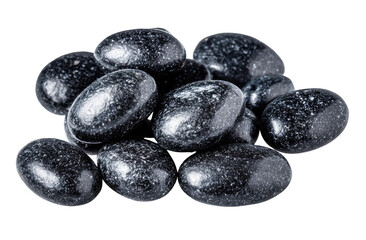 Dark, glossy, oval-shaped candies, speckled with tiny light spots, clustered together