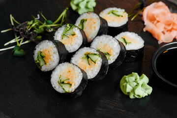 Sushi rolls with avocado and salmon close up