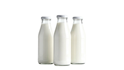 Three old-fashioned glass milk bottles, filled with white liquid, against a black background
