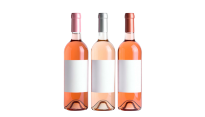 Three glass bottles of ros? wine with blank labels against a black background