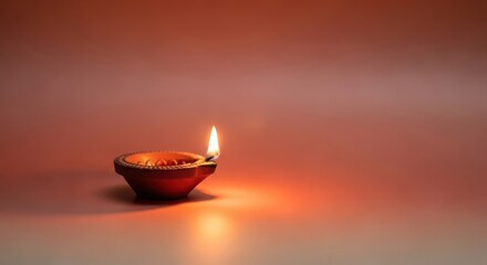 Earthen diya lamp glowing on the occasion of deepavali