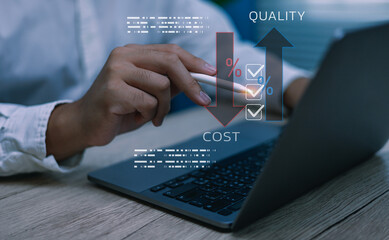Businessman analyzing cost reduction and quality improvement using stylus pointing at laptop and digital chart, Concept of business efficiency, ROI, and financial management in modern technology