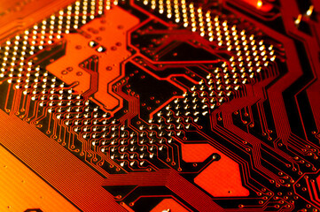 Macro photo of application specific integradet circuit package mounted on printed circuit board. Hardware technology concept. Motherboard. Computer component