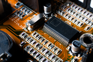 microscheme close up with plenty tiny pieces. Many capacitors, resistors on board. Digital engineering photo
