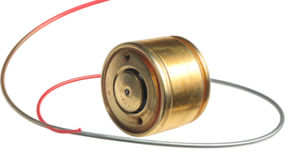Shiny brass cylinder with wires and recessed, dark center disk