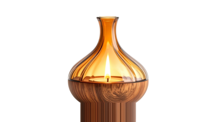 Glowing candle in amber glass holder on a wooden base