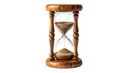 Sand flows in a classic hourglass; time passing in wooden frame